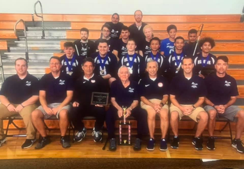 Tom Parrigin (front row center) is pictured with the Florida School for the Deaf and the Blind goalball team at the 2018 Youth National Championships. Current USA Goalball Men's National Team Coach Keith Young is seated far right in the front row.