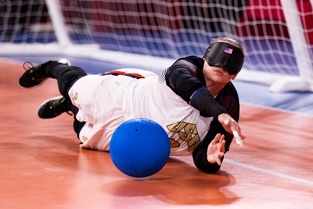 Lisa Czechowski dives to stop a goalball during the Tokyo Paralympic Games.